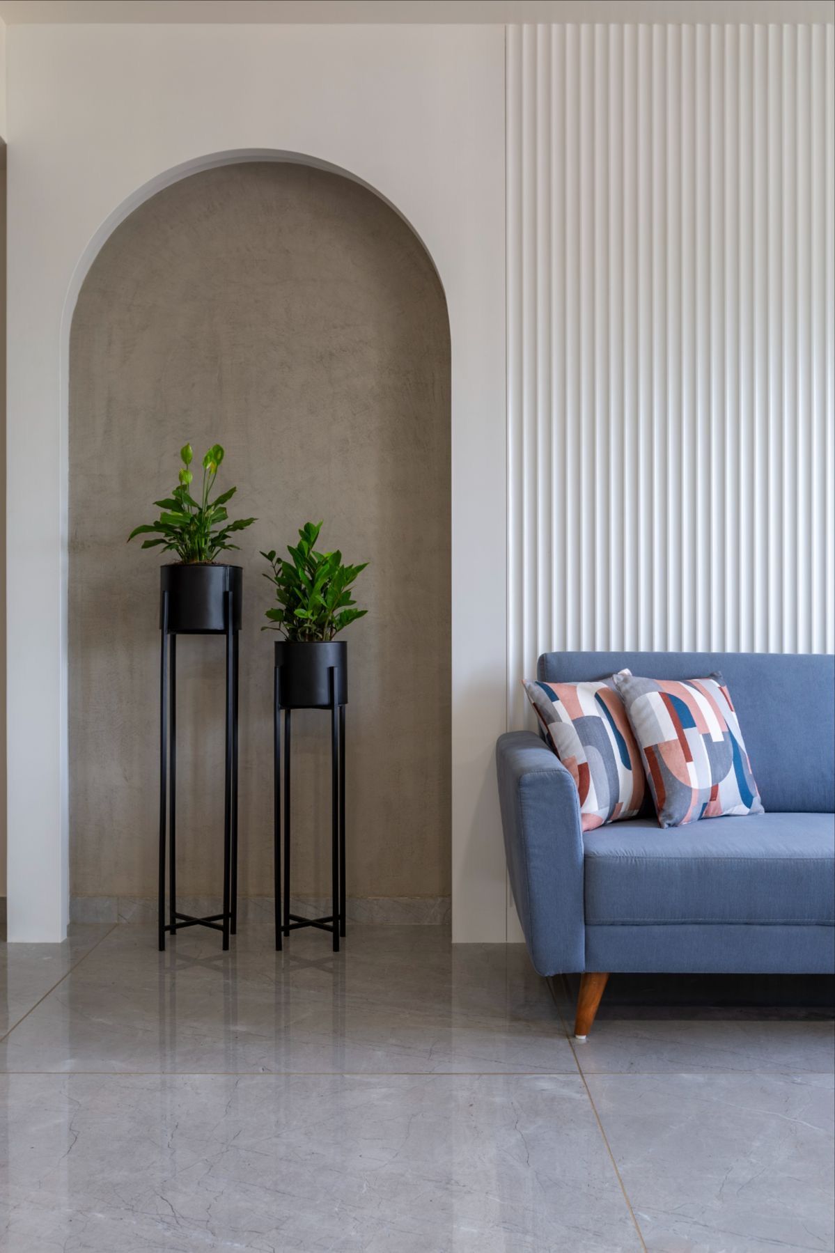 A warm living room styled with rattan and modern art